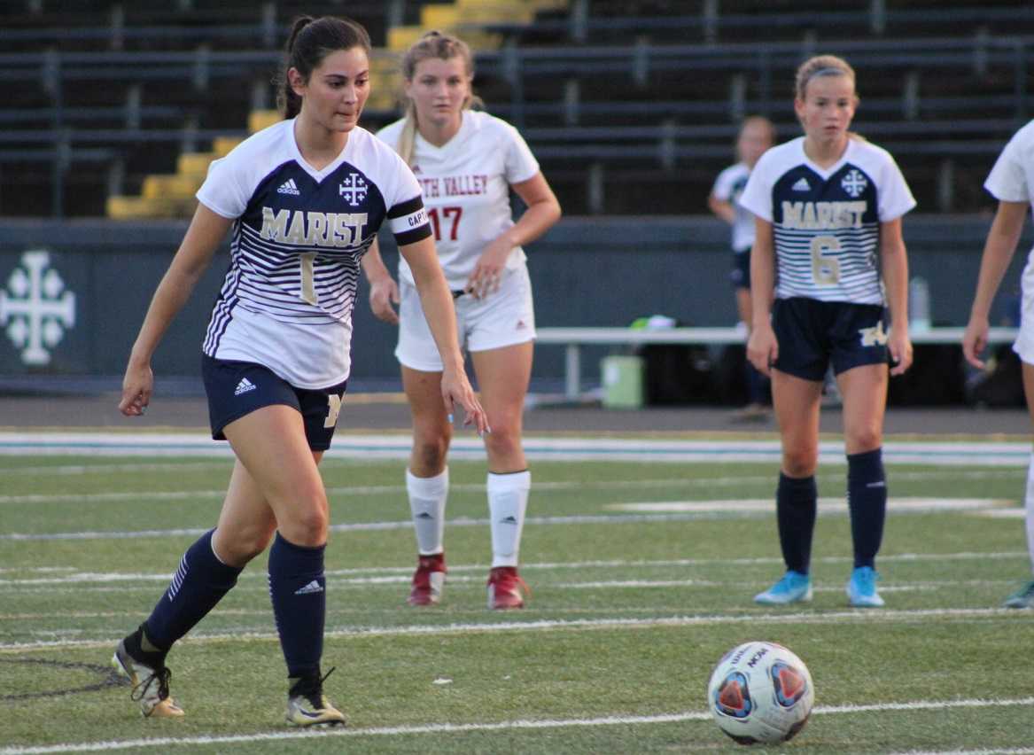 Senior Ella Coulombe is part of a dynamic midfield for Marist Catholic. (Photo by Kevin Cave)