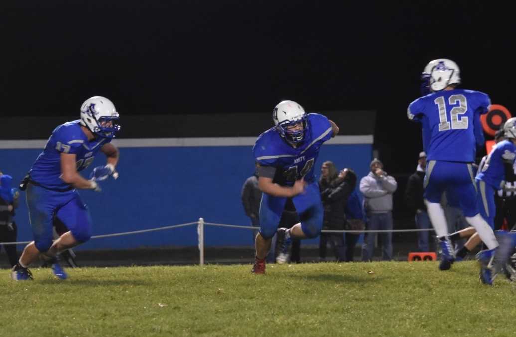 Cody Dyche (left), Russel Brown (center) and Keenan Graham (12) helped lead Amity past Coquille. (Photo by Jeremy McDonald)