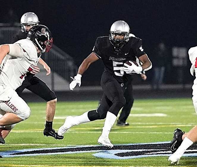 EJ Broussard rushed for a team-high 64 yards for Mountainside against Clackamas. (Photo byJon Olson)