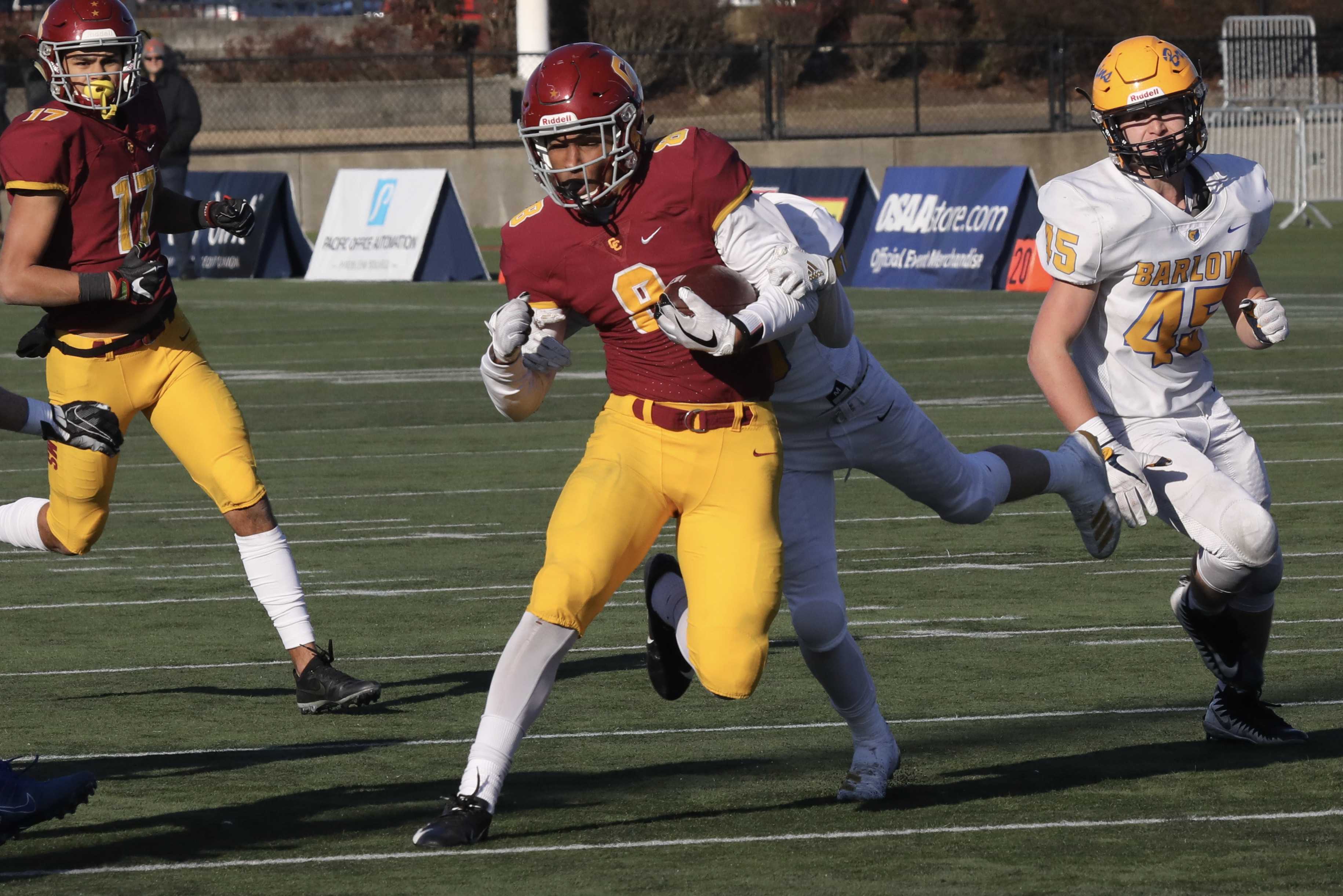 Central Catholic's Silas Starr cruises through Barlow's defense with a 25-yard passs from Cade Knighton to set up a touchdown.