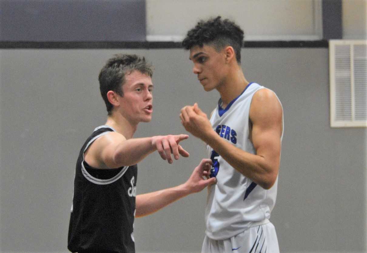 Santiam's Colin Thurston (left) matches up against Western Christian's Payton Richardson. (Photo by Jeremy McDonald)