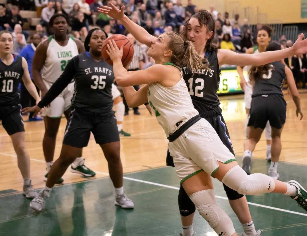 West Linn's Cami Fulcher shoots against St. Mary's Academy's Anny Eddy on Friday. (Photo by Gene Schwartz)