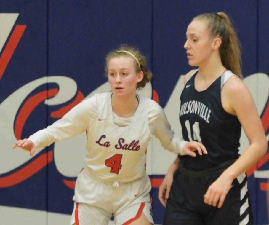 La Salle Prep's Lindsay Drango (4) defends Wilsonville's Emilia Bishop on Friday night. (Photo by Derrick Drango)