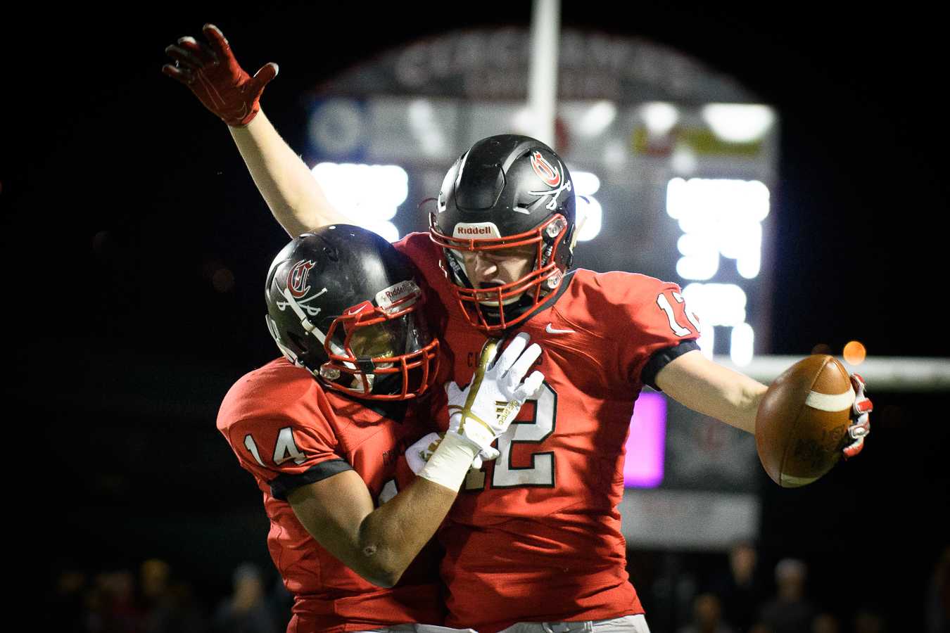 Clackamas' Richard Kennewell (12) celebrates with Jailen Hammer. (Photo by Ken Waz/OregonLive)