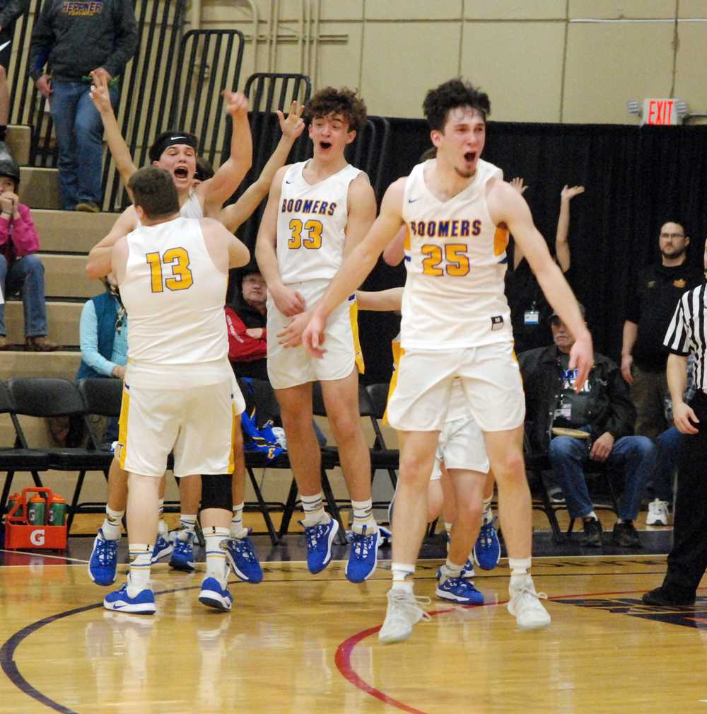 Clifton Howard (25) and his Toledo teammates celebrate a first state team title in any sport