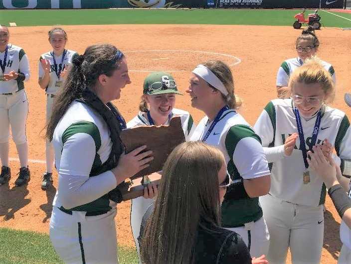 Sheldon softball players celebrate after winning the 6A title last year.