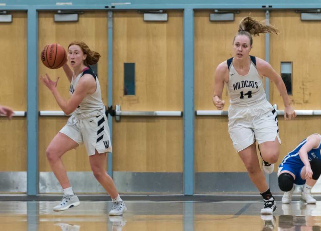 Sydney Burns (left) and Emilia Bishop (14) were first-team NWOC selections for Wilsonville last season. (Photo by Greg Artman)