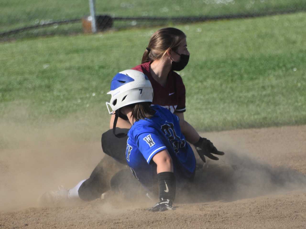 Amity's McKenzie Turley slides into second base against Dayton's Lacey Smith on Tuesday. (Photo by Jeremy McDonald)