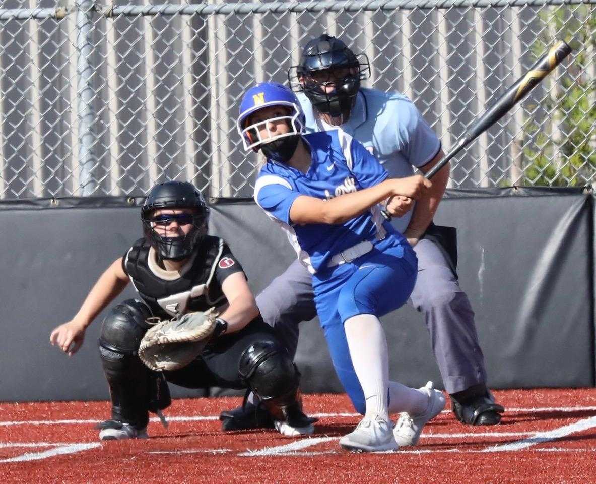 Newberg's Abby Carsley, homering Monday at Glencoe, has eight home runs and 28 RBIs. (Photo by Norm Maves Jr.)