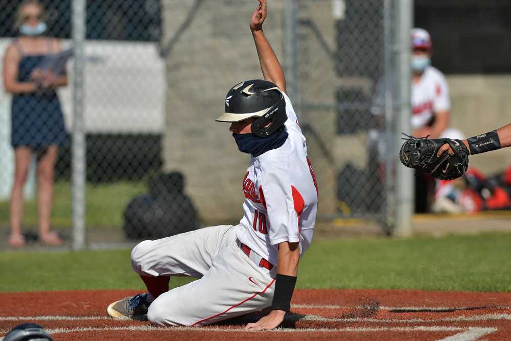 Dylan Kleinschmit touches home plate, something no league opponent has been able to do with the Kennedy hurler on the mound