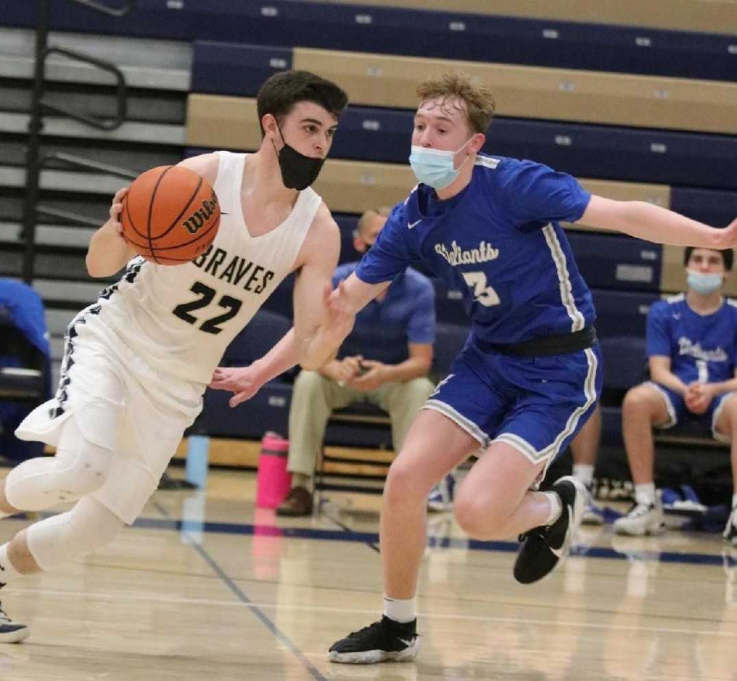 Senior point guard Joseph Buliga (22) is part of a balanced Banks attack. (Photo by Stewart Monroe)