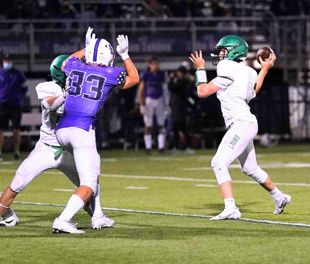 West Linn's Chase Harmon threw for 268 yards and three touchdowns Friday at Sunset. (Photo by Jon Olson)