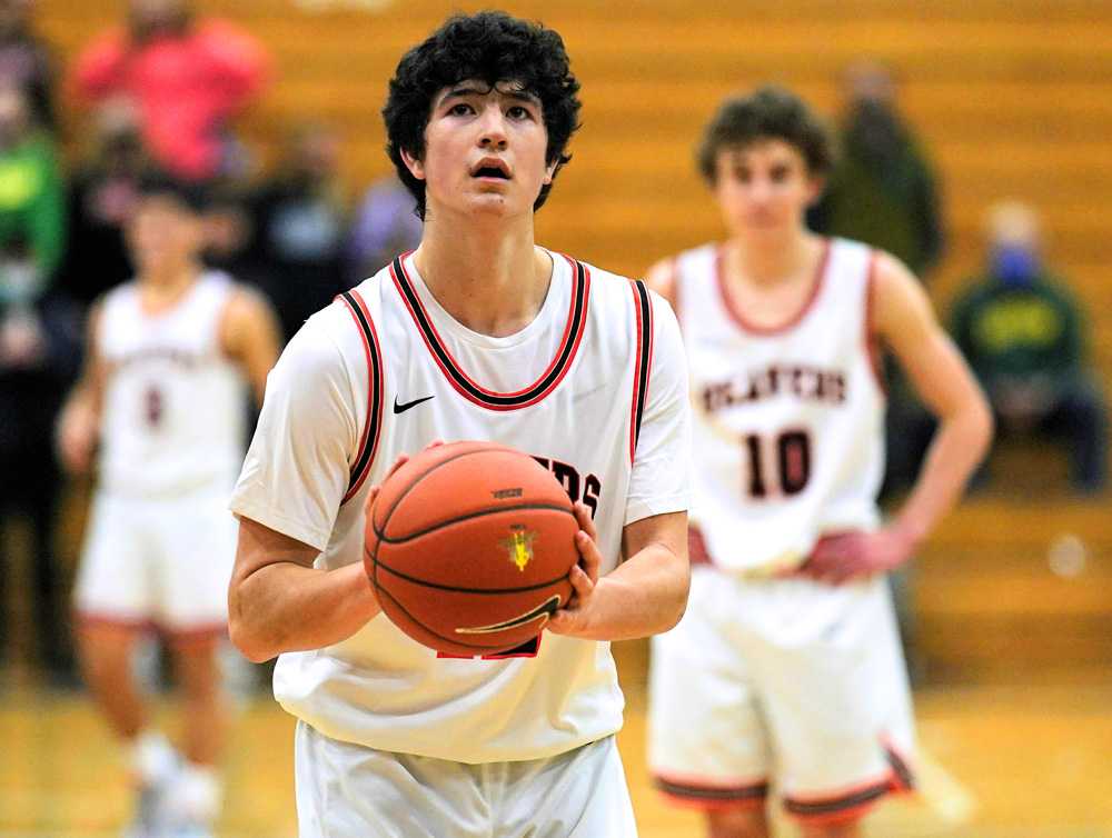 Brady Rice prepares to hit game-winning free throw, sending Beaverton past Central in an opening-round game (Jon Olson).