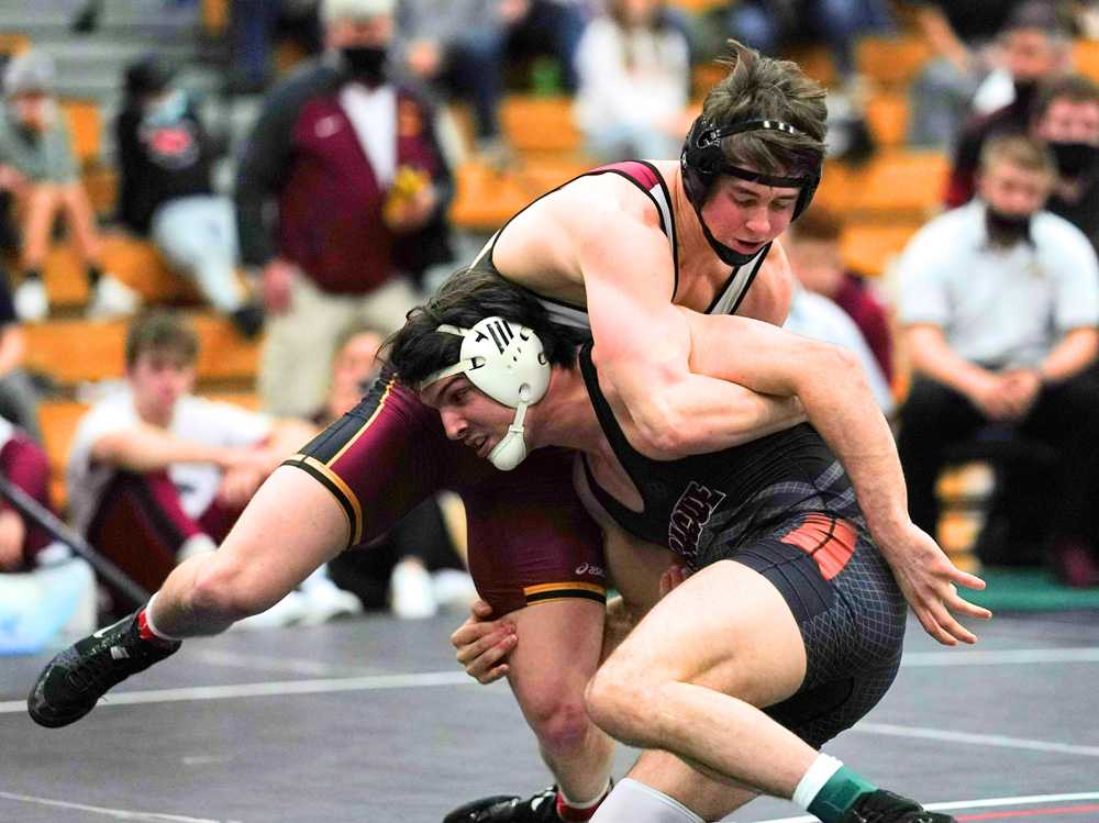 Crescent Valley's James Rowley (top) held off Sprague's Brook Byers at 182 in a match of two-time state champs (Jon Olson)