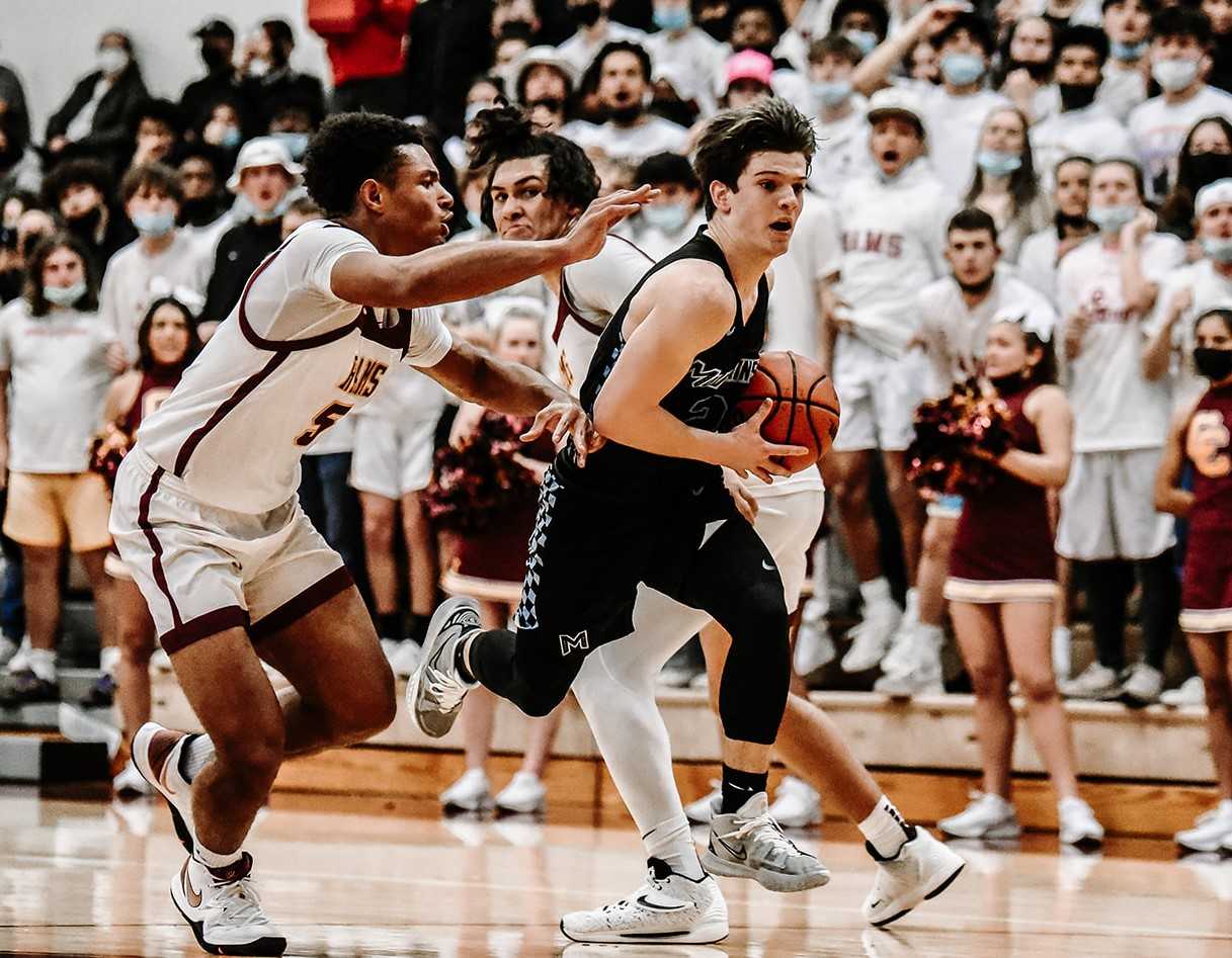 Mountainside's Dimitri Cohen drives past Central Catholic's Jordan King (5). (Photo by Fanta Mithmeuangneua)