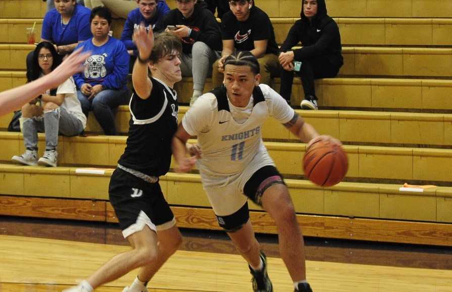 De La Salle North Catholic's TJ Latu drives to the basket against Dayton in a semifinal Friday. (John Gunther/The World)