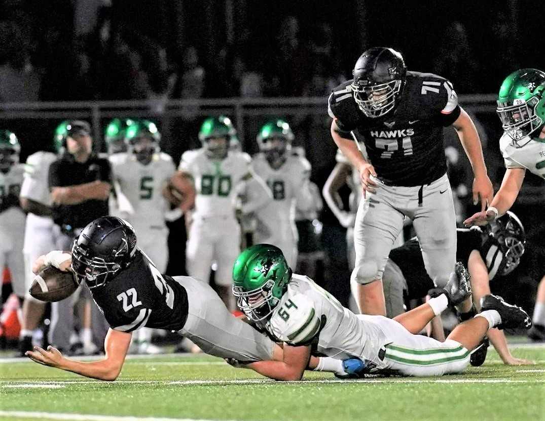 Boone Standley (71) has helped open gaps for Nelson running backs such as Jack Gandert (22). (Photo by Jon Olson)