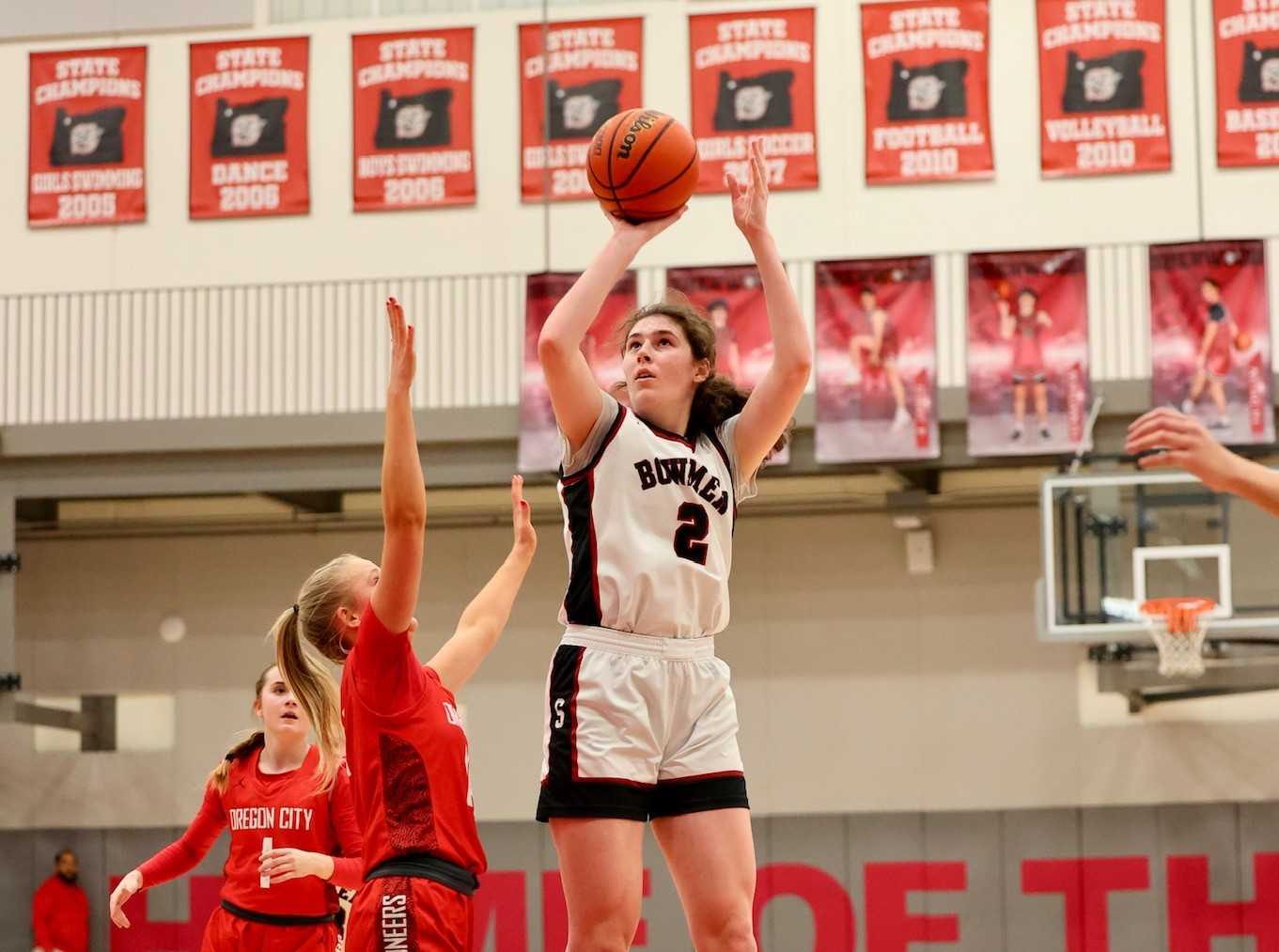 Sherwood junior Ava Heiden, shooting against Oregon City, committed to Iowa in October. (Katie Karl/Sherwood Girls Basketball)