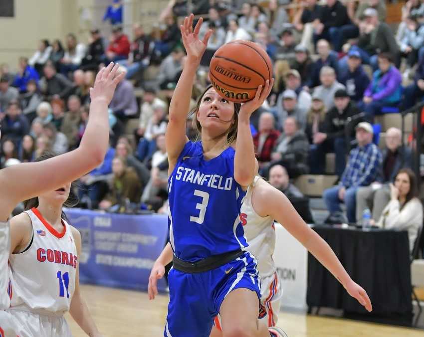 Stanfield senior Alexis Mallory drives to the basket in Friday's semifinal win over Central Linn. (Photo by Andre Panse)