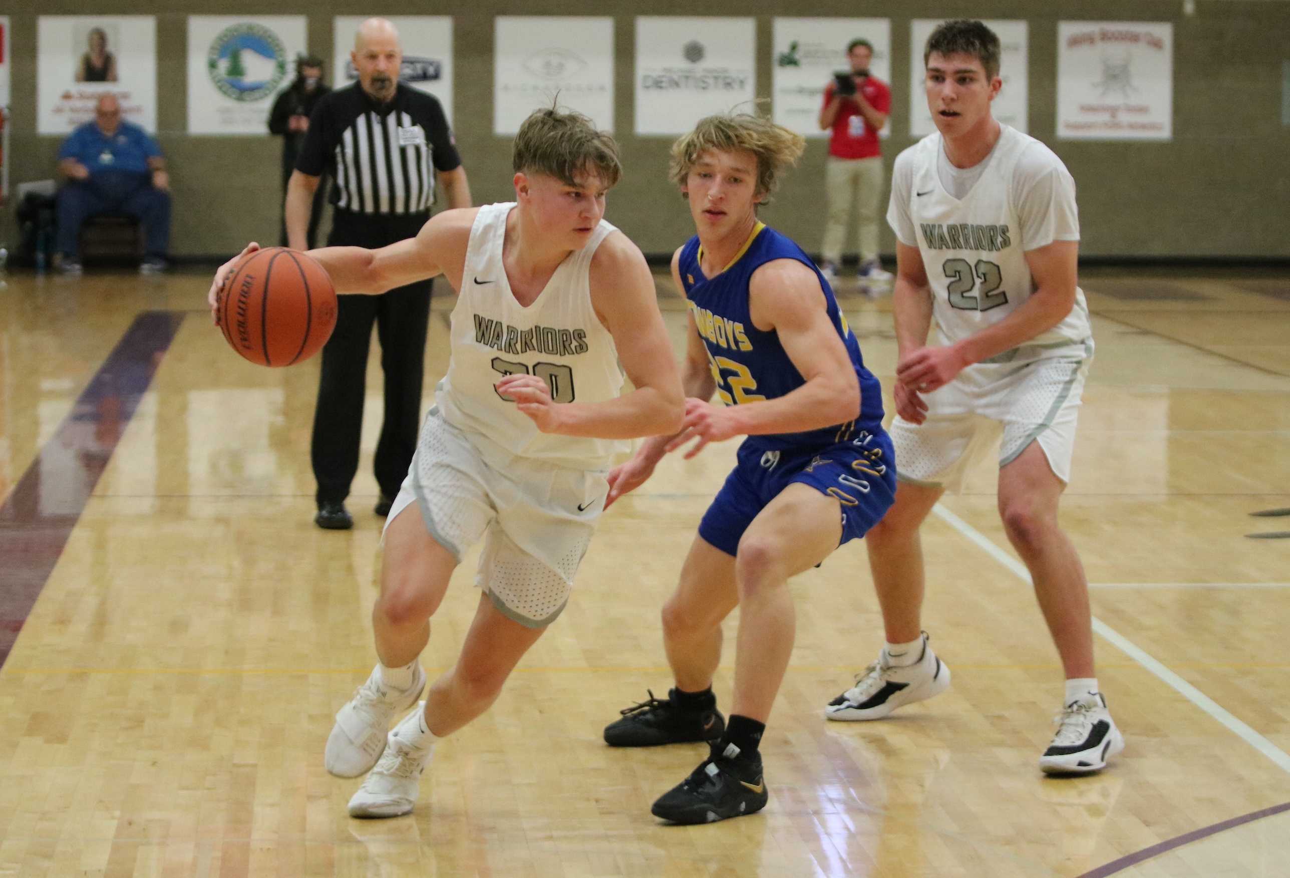 Philomath's Cole Beardley's (left) drives on Crook County's Kiernan Teasdale in Thursday's first half. (Photo by Jim Beseda)