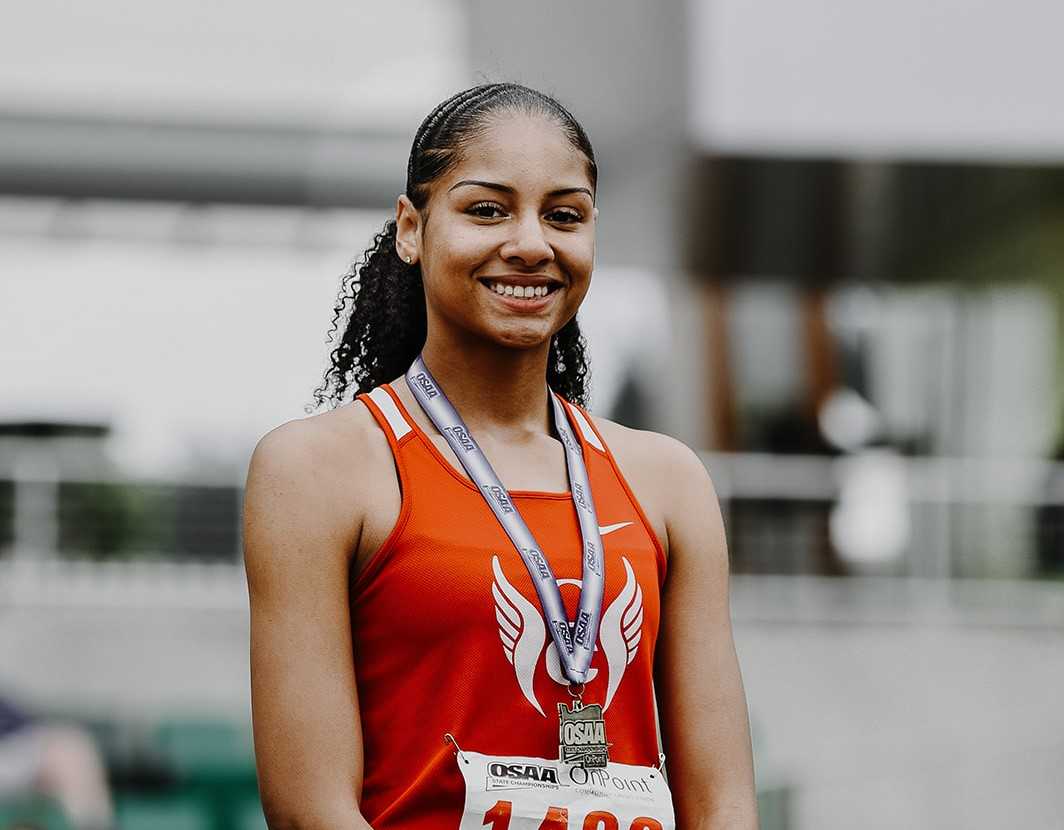 Oregon City's Sophia Beckmon broke her own state long-jump record for the second time this season. (Photo by Fanta Mithmeuangneu