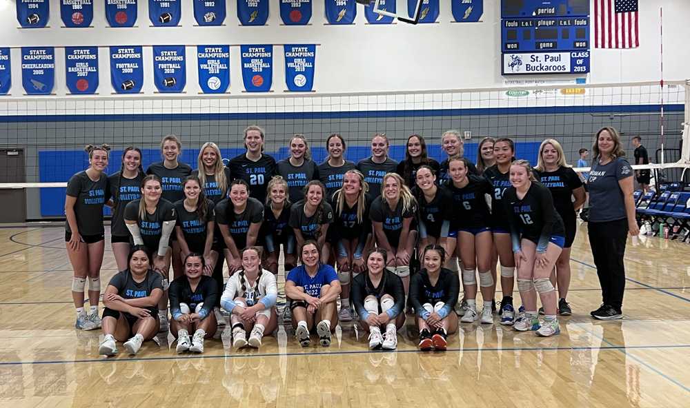 St. Paul, past and present, pose together after the alumni game, which the current varsity won in sweeping fashion