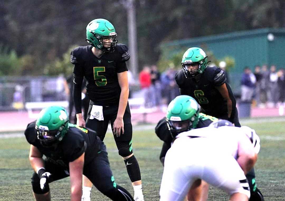 Junior QB Baird Gilroy made his first varsity start for West Linn, throwing for 197 yards and one touchdown.(Photo by Jon Olson)