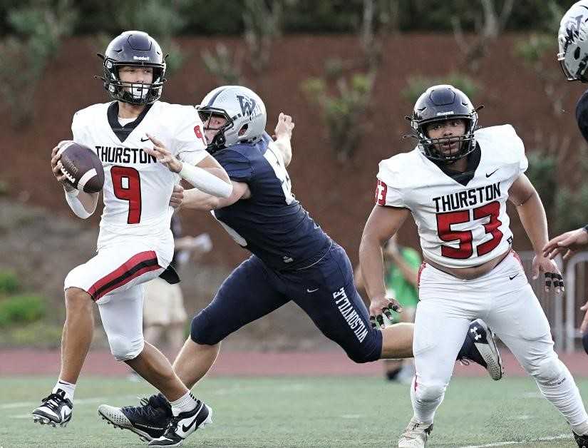 Thurston's Noah Blair has passed for 33 touchdowns this season, giving him 55 in two years as the starter. (Photo by Jon Olson)