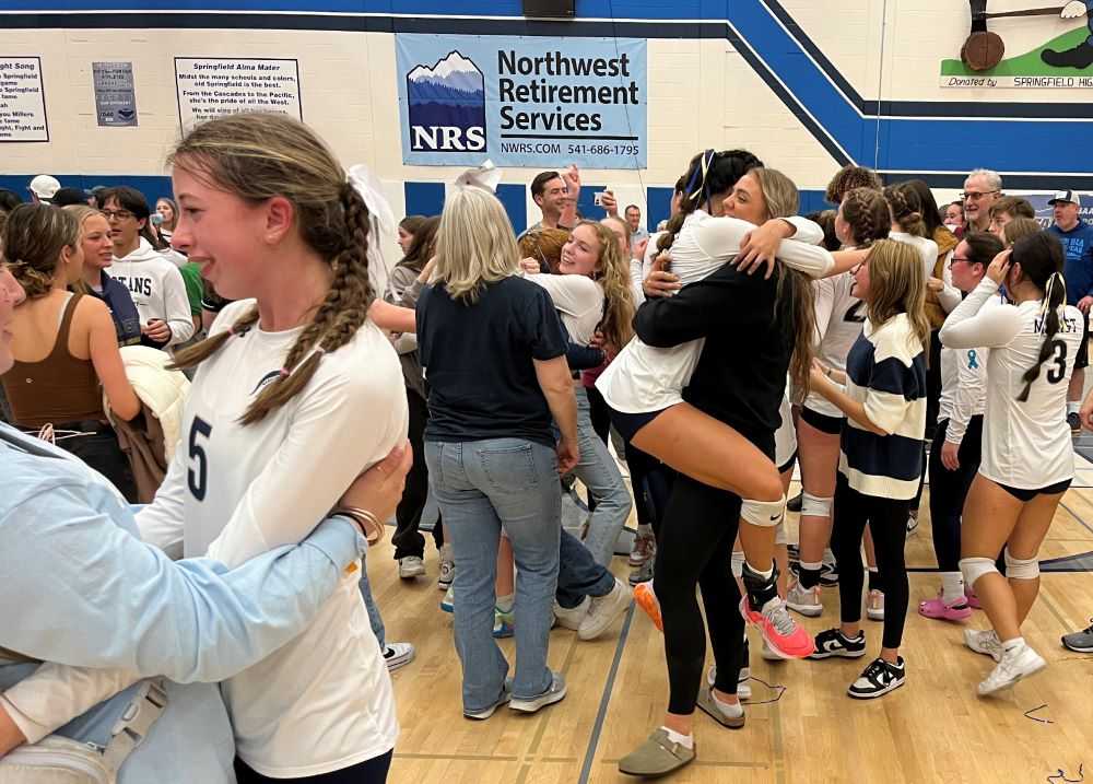 Marist Catholic freshman Kimmy Spurlock (5) celebrates in the foreground while Giana Elgarico elevates for a hug