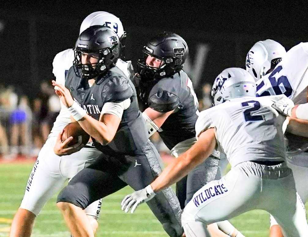 Tualatin quarterback Nolan Keeney rushed for 116 yards in a Week 3 win over 5A No. 1 Wilsonville. (Photo by Jon Olson)