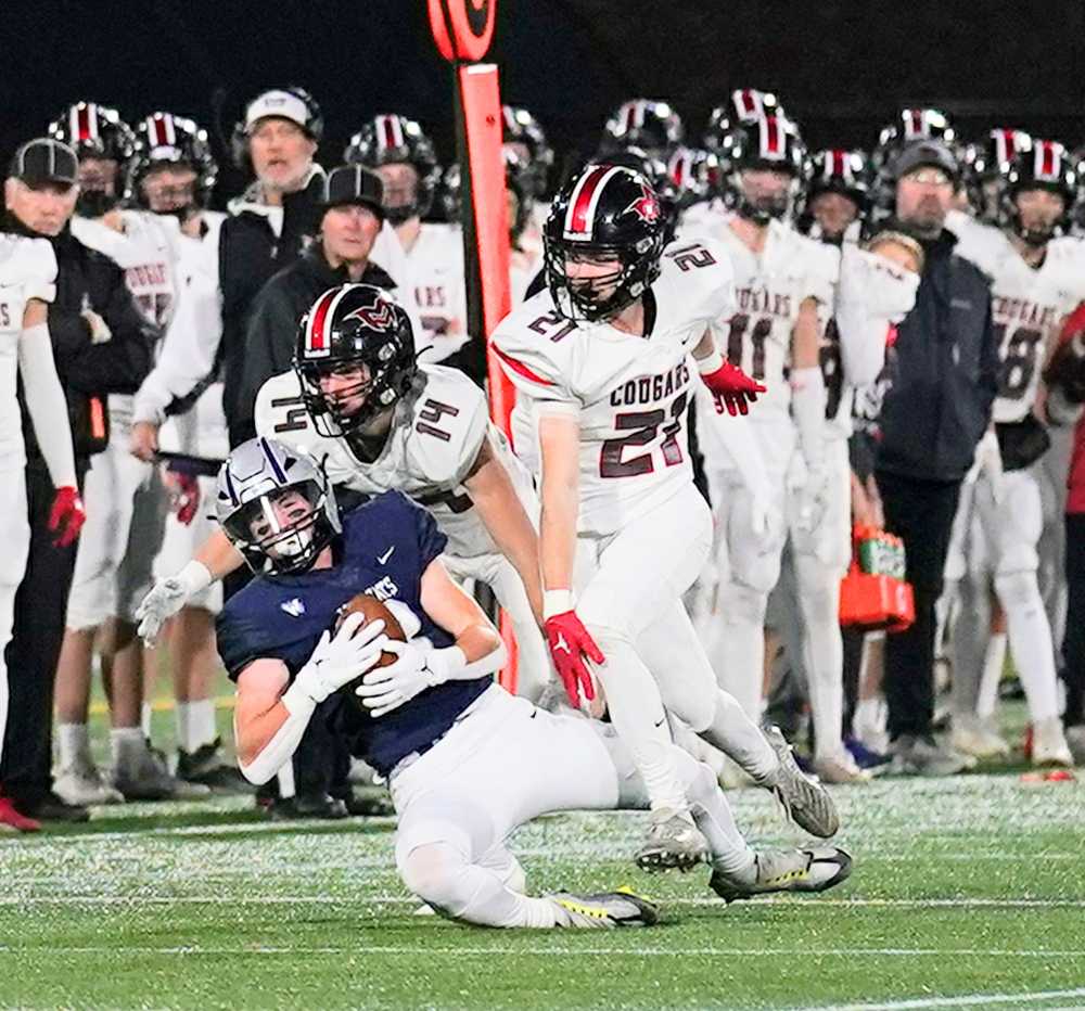 Nick Crowley (with ball) went over 100 yards receiving for 5A champion Wilsonville (Jon Olson)