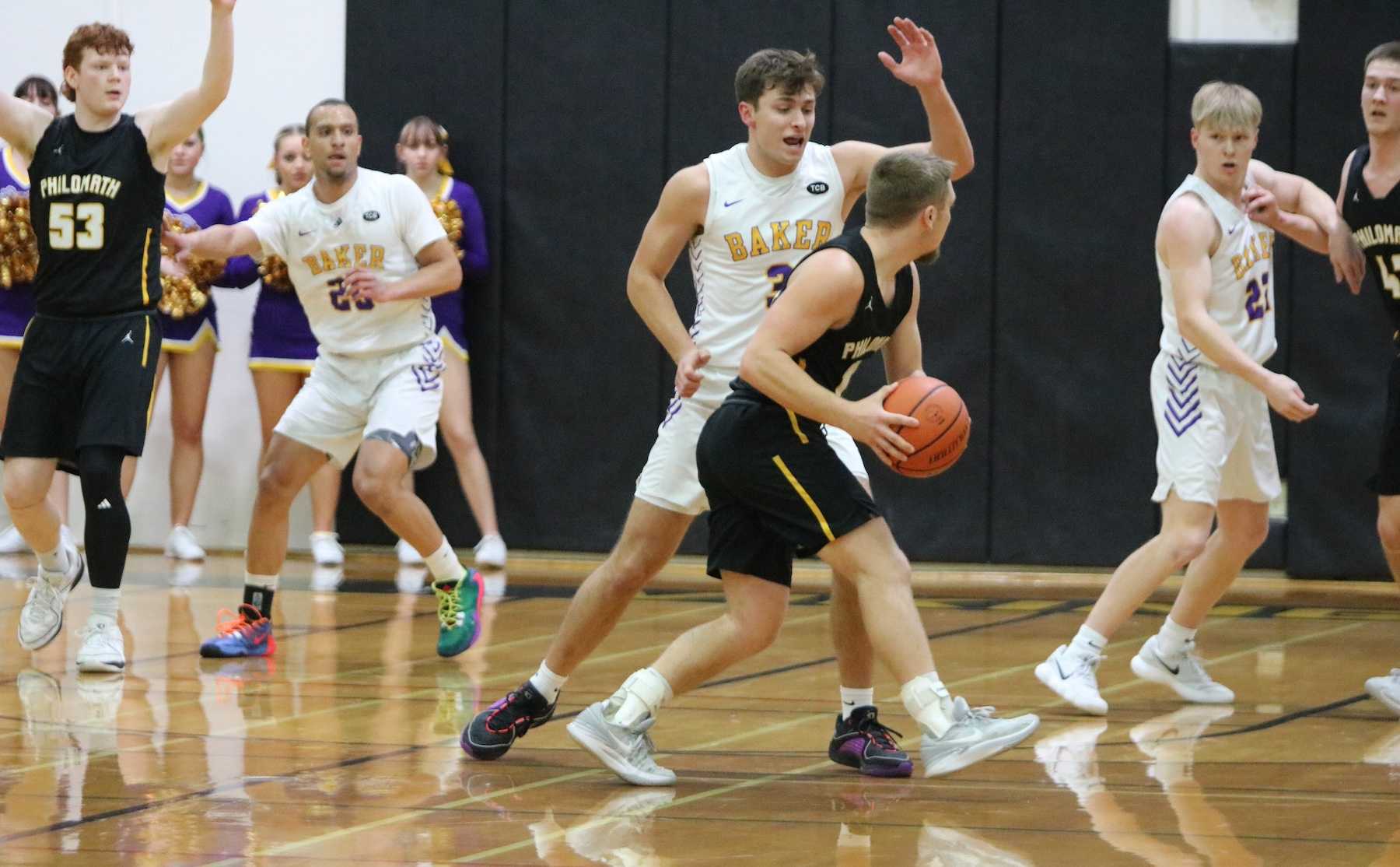 Baker's Paul Hobson (3) puts pressure on Philomath's Kaden Muir during Thursday's first half. (Photo by Jim Beseda)