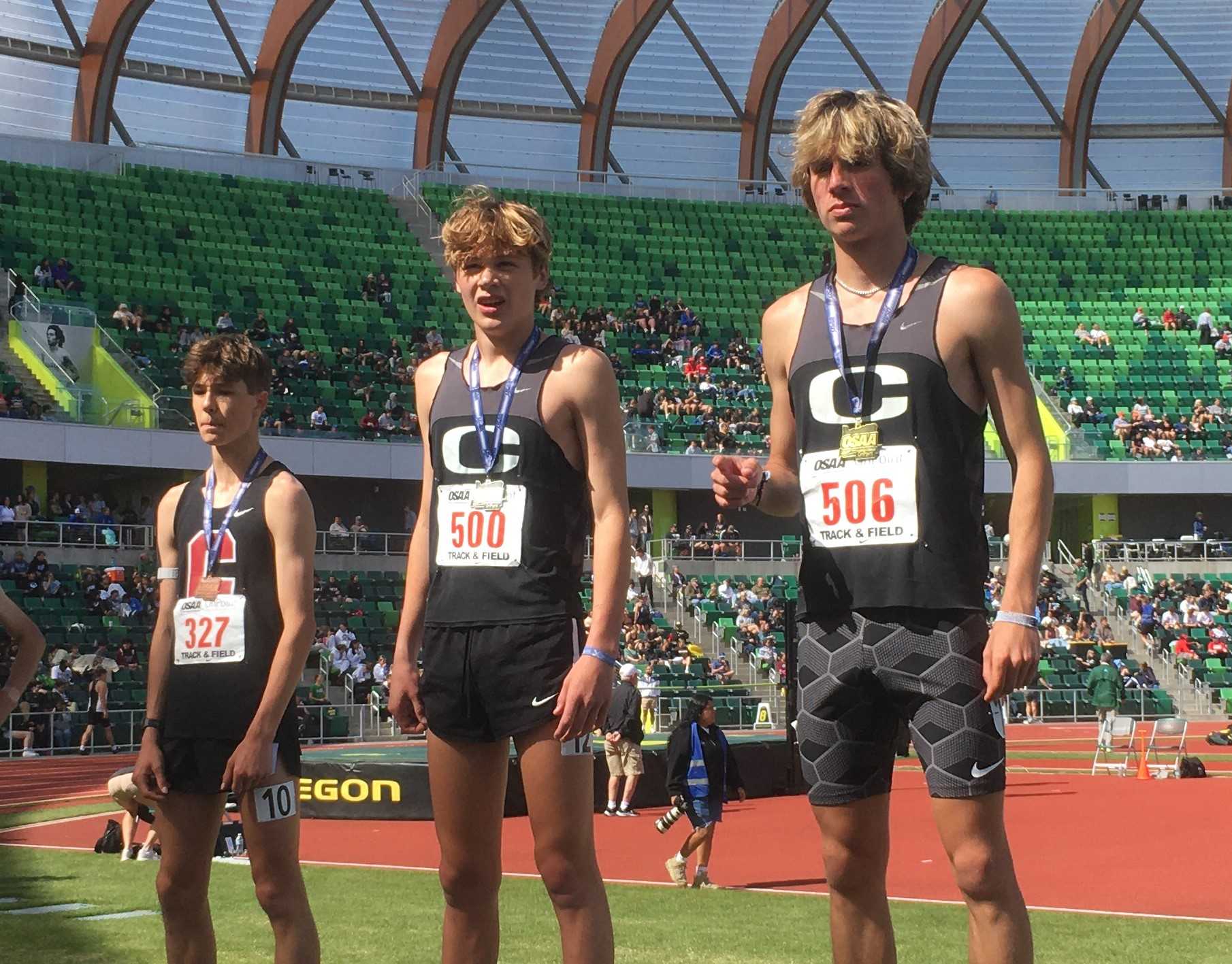 Crater's Josiah Tostenson (right) beat teammate Tayvon Kitchen (center) and Central's Ty Cirino (left) in the 5A 3,000 meters.