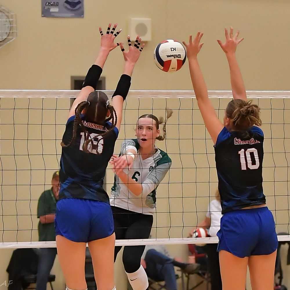 Emma Brewer splits the Crosshill Christian for one of her 27 kills in Salem Academy's title sweep (Andre Panse)