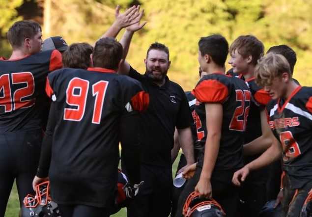 Powers coach Ricky Ostle said he fell in love with American football when he joined the staff in 2018. (Photo by Lindy Stallard)