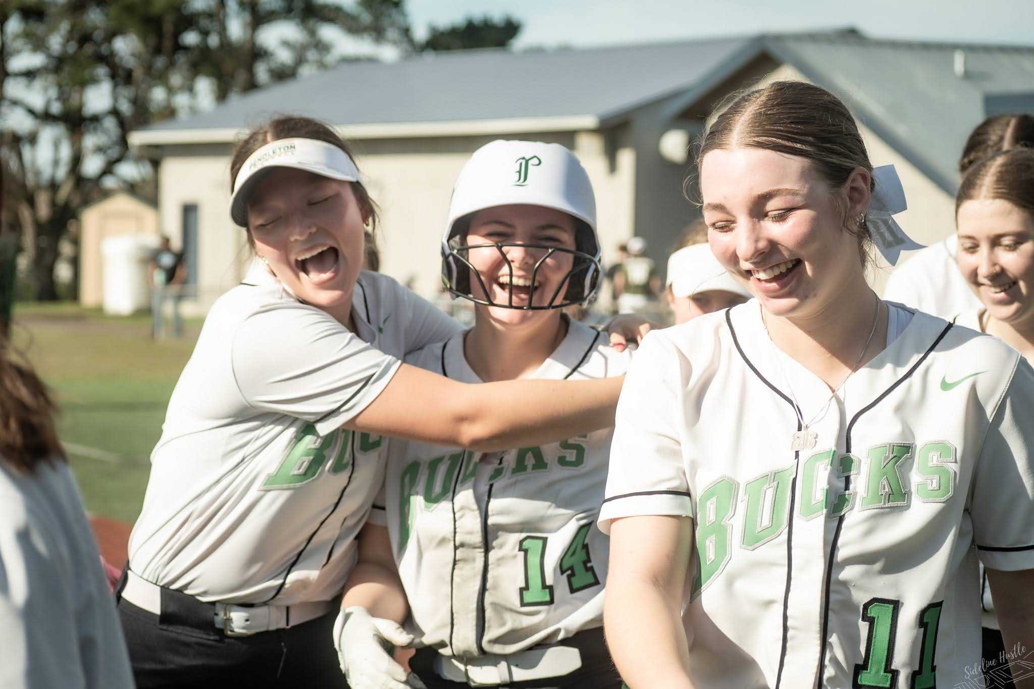 Pendleton's Josie Jenness (14) is congratulated by teammates after homering against South Umpqua. (Photo by Julie Murphy)
