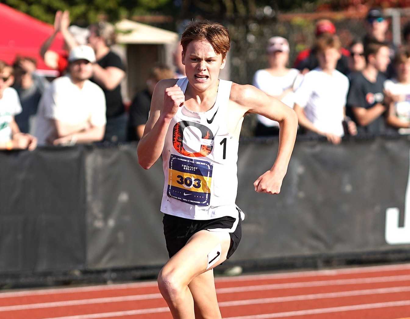 Crater's Tayvon Kitchen took more than 10 seconds off his PR to win the 3,200 at the Jesuit Twilight meet. (Photo by J.R. Olson)