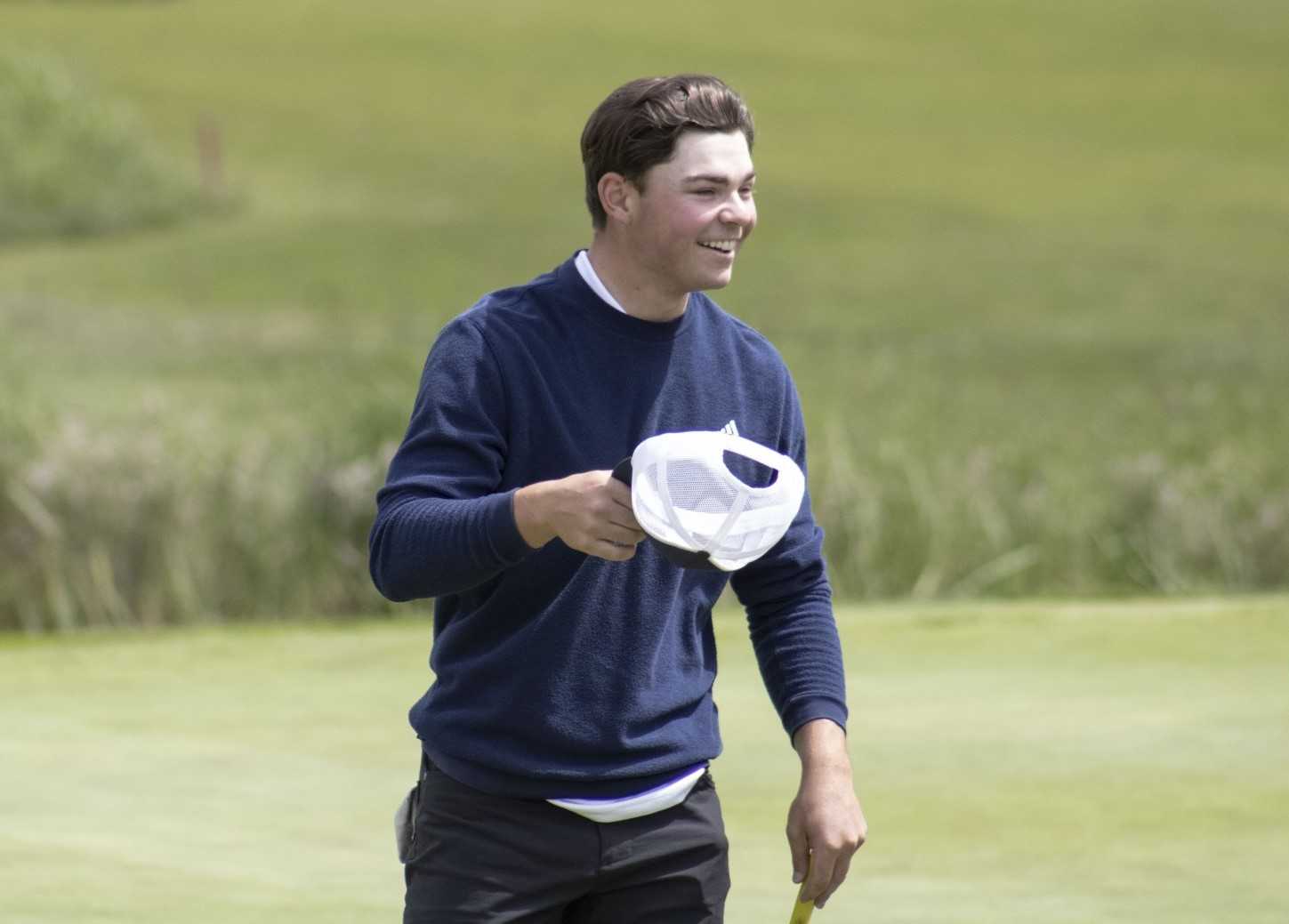 Lake Oswego junior Drew Woolworth celebrates after winning the 6A golf title at OGA Golf Course. (Photo by Chris Burkhardt)