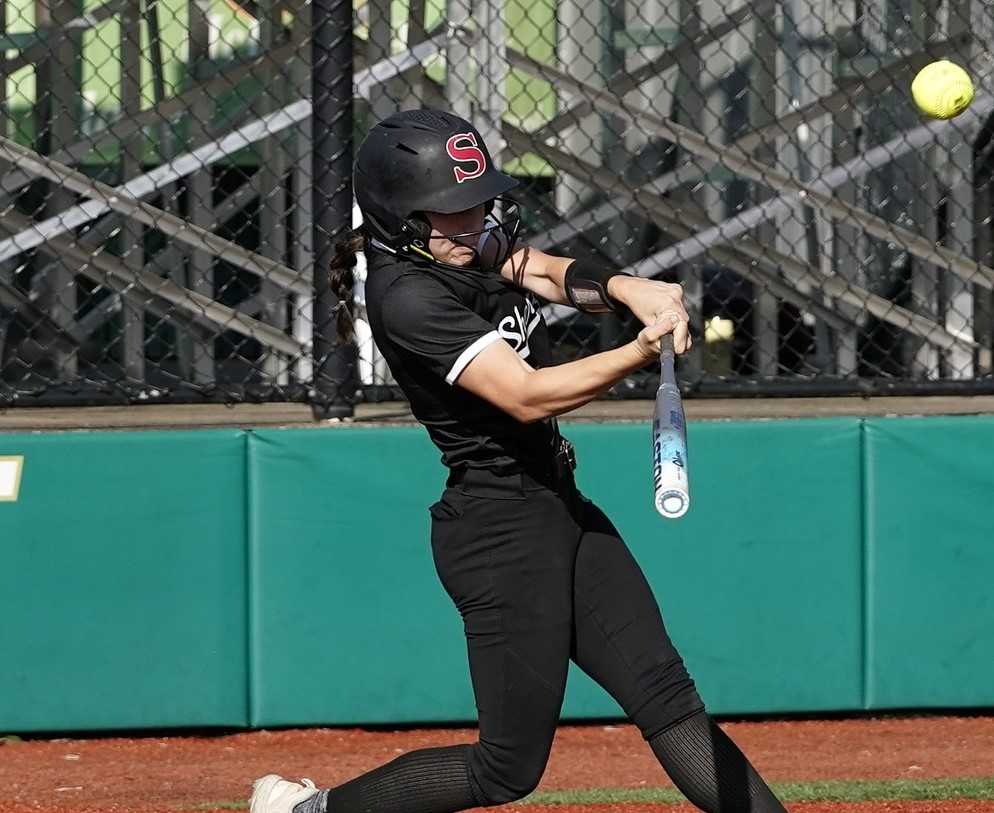 Sherwood's Maisy Schindler hits a grand slam in the fourth inning for a 6-0 lead over Jesuit on Tuesday. (Photo by JR Olson)