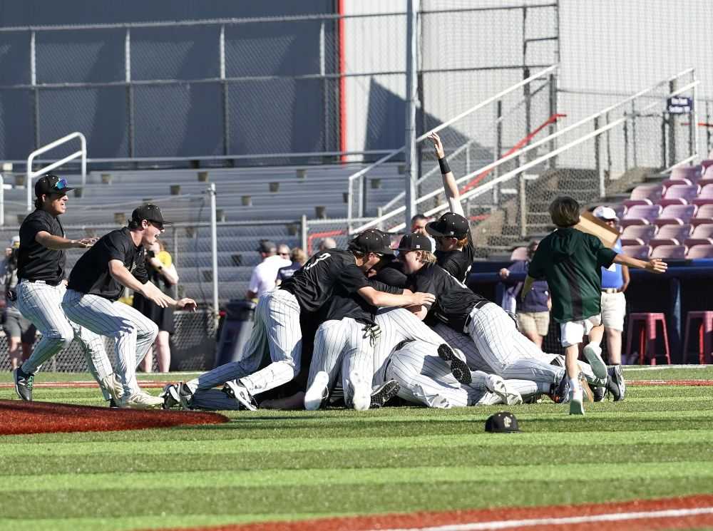 The Pendleton dogpile was extra special after coming up short in six previous attempts at a state title (Jon Olson)