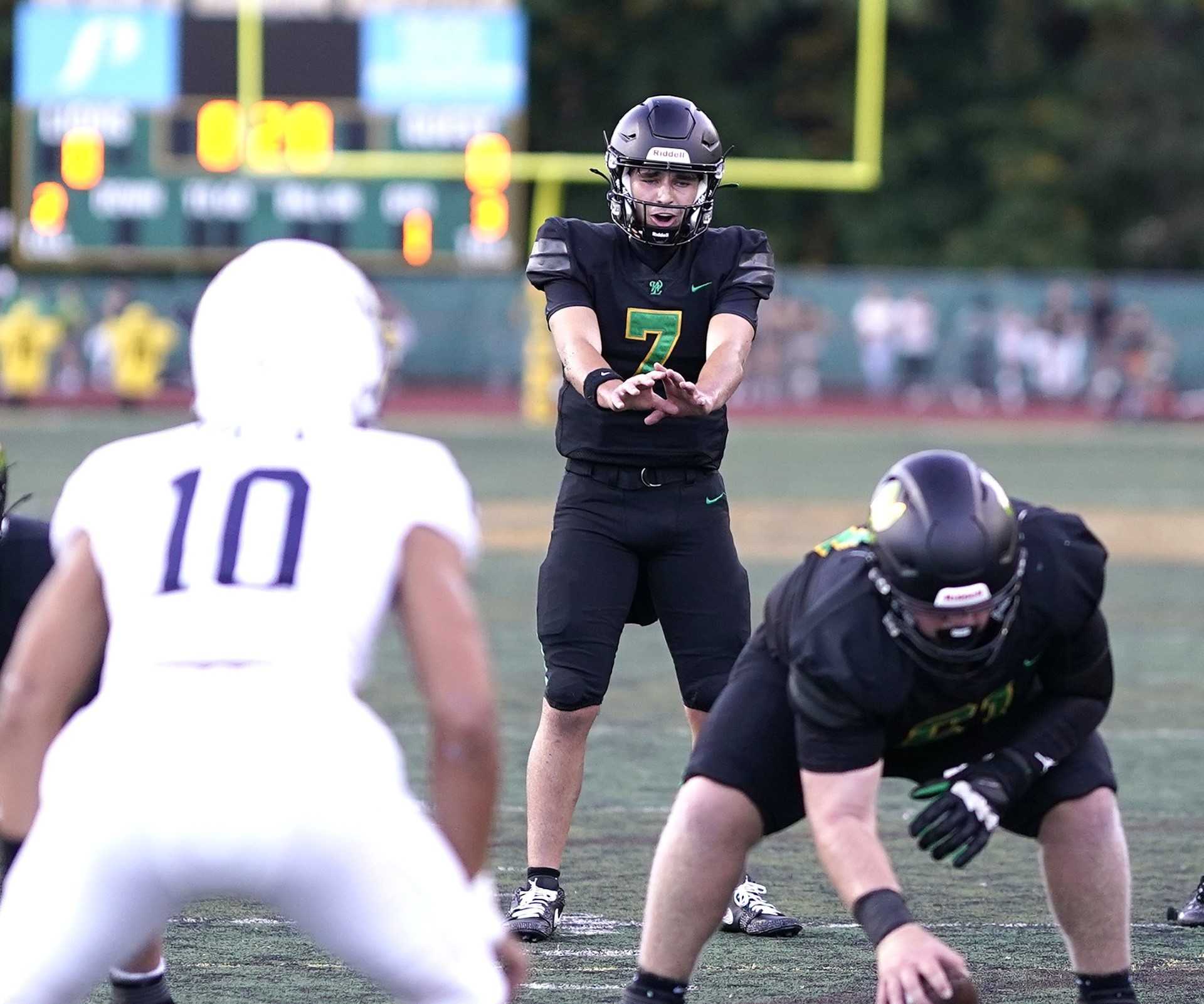 West Linn's Sloan Baker threw touchdown passes on his team's first three possessions Friday night. (Photo by J.R. Olson)
