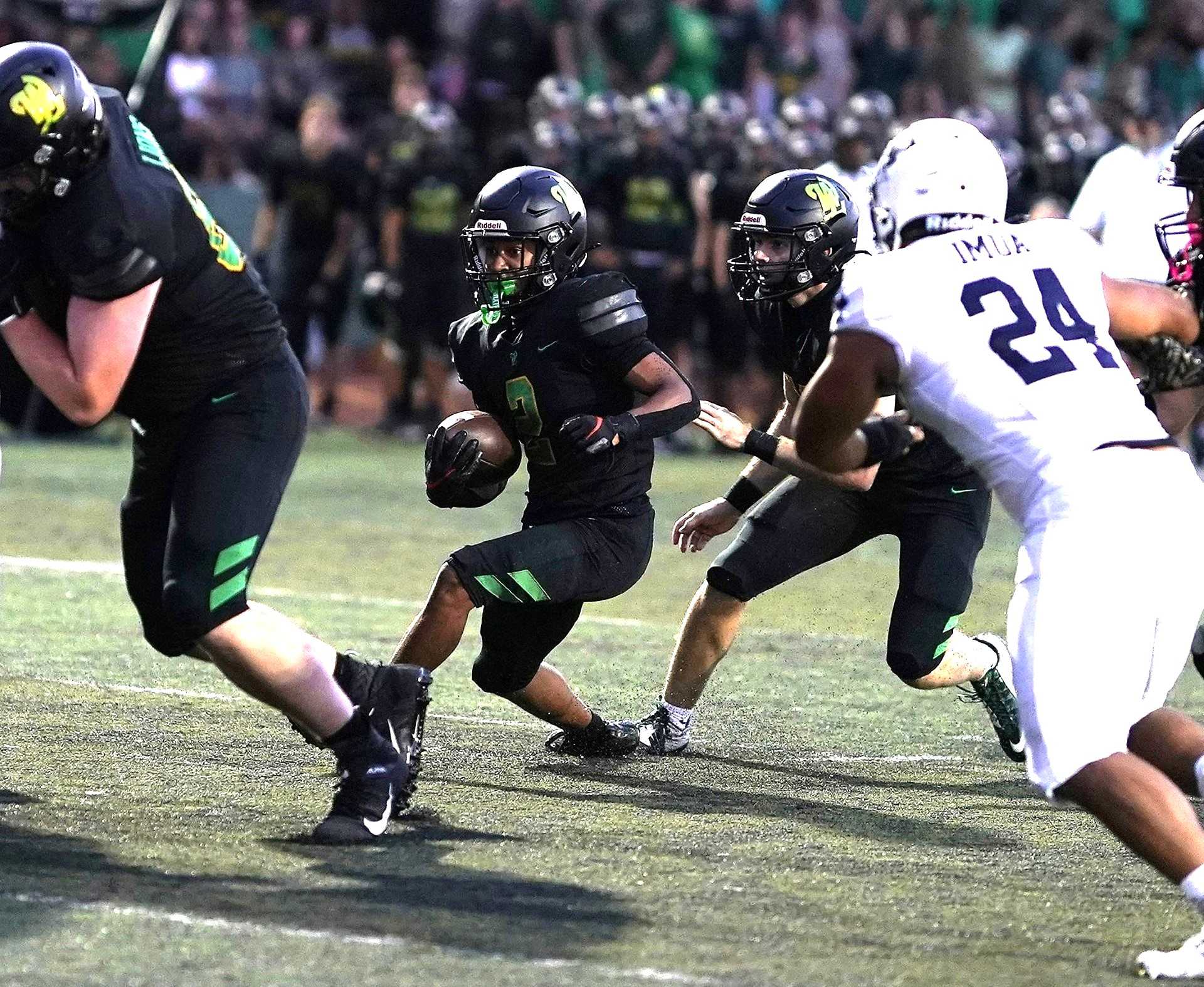 West LInn senior Viggo Anderson scored TDs rushing and receiving in Friday's 48-21 win over Kamehameha. (Photo by J.R. Olson)