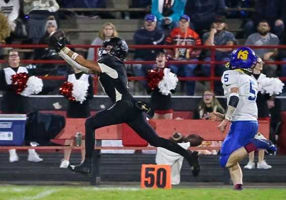 Clatskanie receiver Ayden Blackshire gets behind the Knappa defense in Thursday's 21-14 win. (Photo by Skyler Smith)