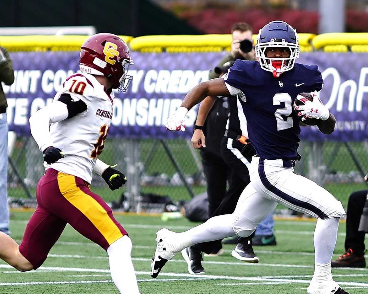 Lake Oswego's LaMarcus Bell (2), chased by Central Catholic's Asa Lundberg, rushed for 126 yards Friday. (Photo by J.R. Olson)