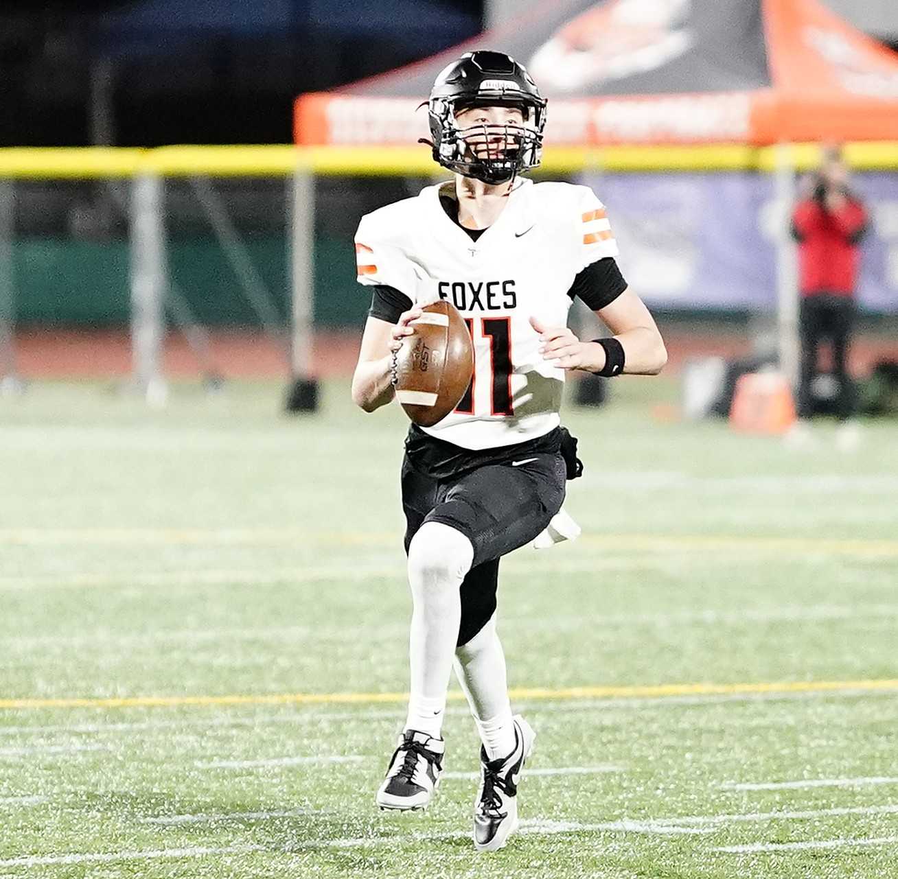 Silverton QB Chase Dominguez looks to pass downfield against Summit in the 5A title game. (Photo by JR Olson)
