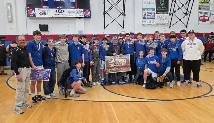 The La Grande boys wrestling teams poses with the 4A SD4 team trophy at Madras High School. (Photo from Klel Carson)
