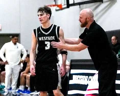 Cade Hartenstein, with coach Marc Howell, leads Westside Christian in scoring at 22.3 points per game. (Photo by Marcus Araneta)