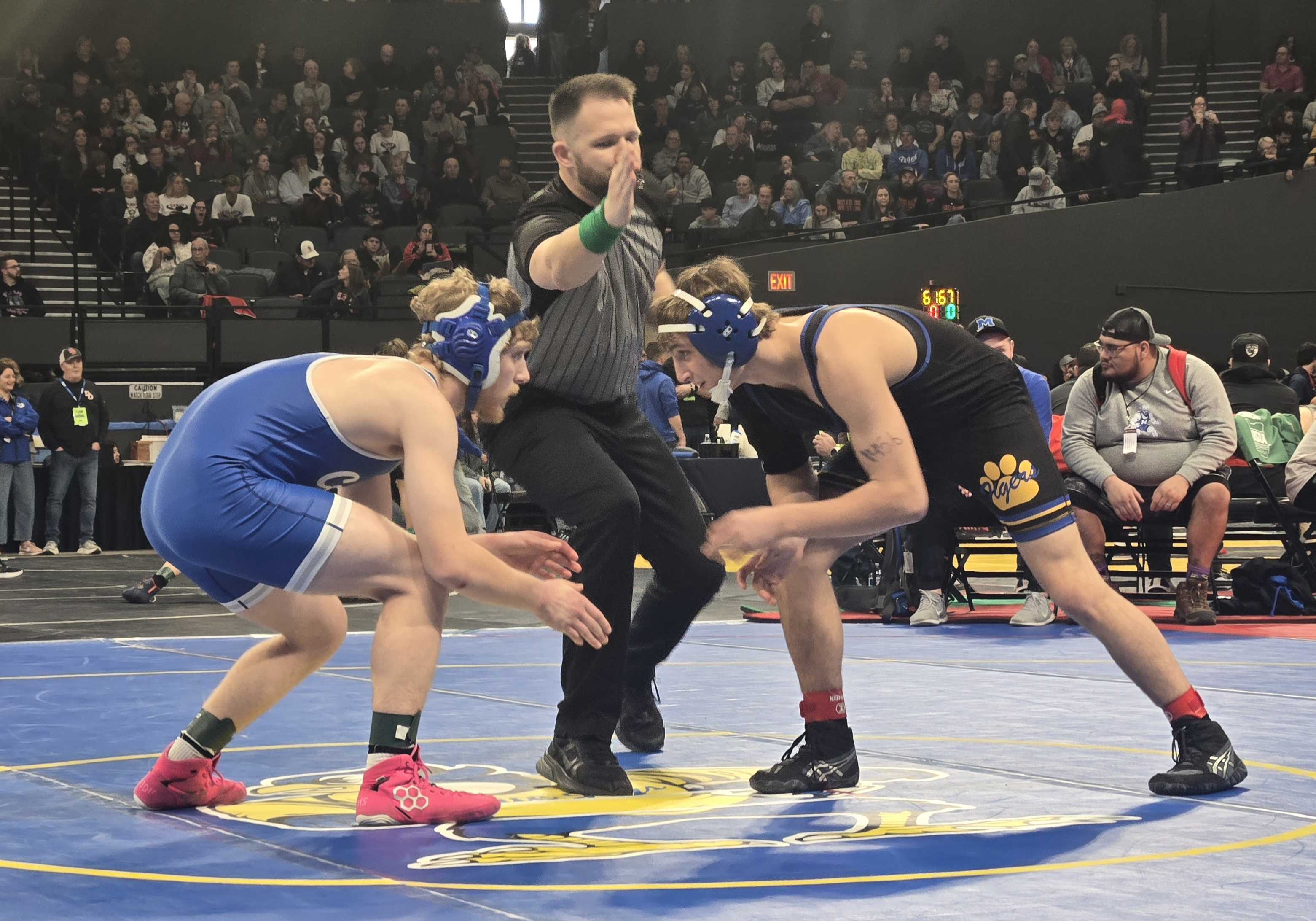 Newberg senior Gavin Rangel, right, begins his 2026 state second round match. (Photo by Austin White)