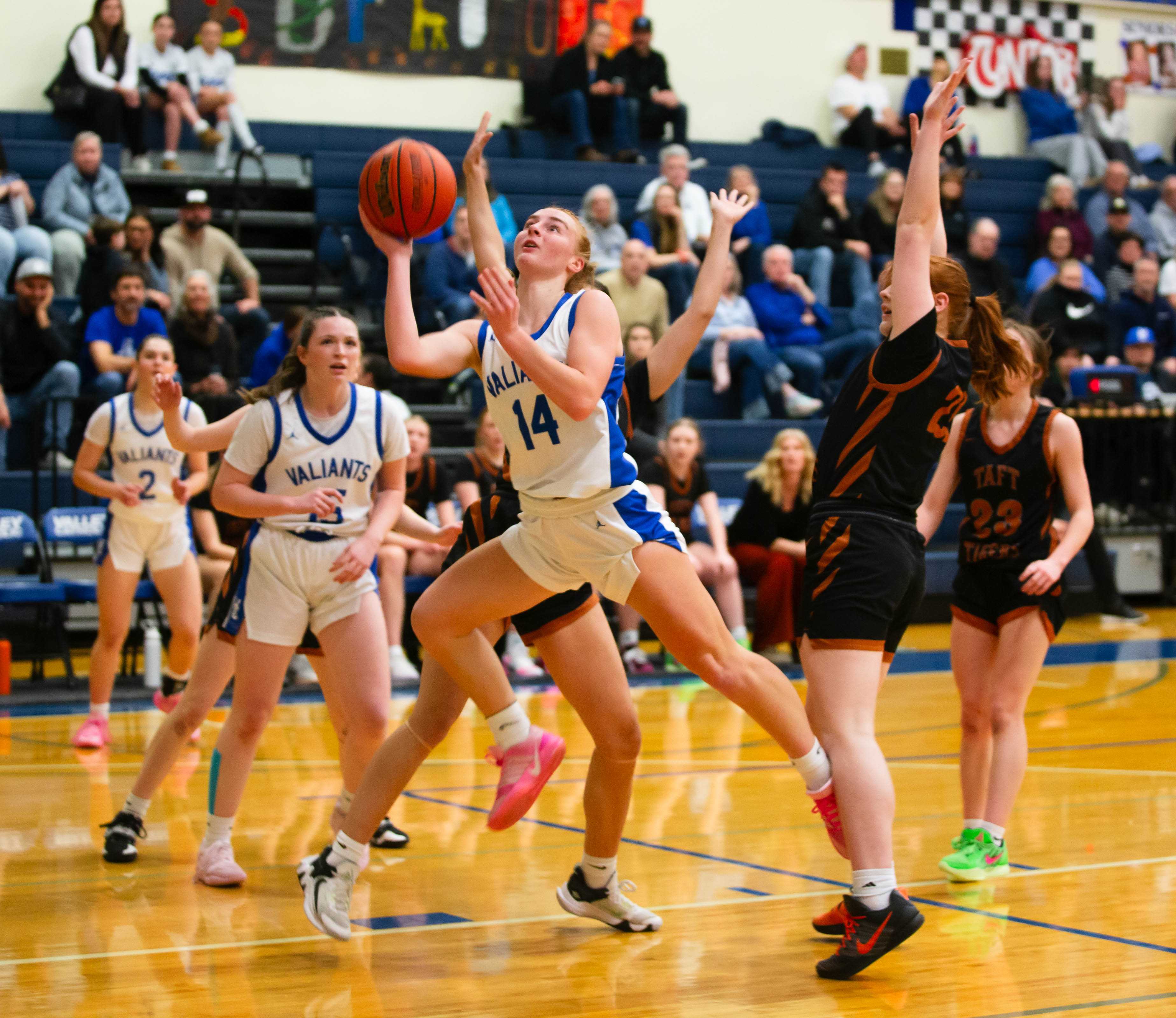 Valley Catholic senior guard Calista Everson drives to the basket in Saturday's playoff win over Taft.(Photo by Allison Weseman)