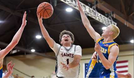 Trinity Lutheran's Chimi Gilbert drives for a lay-in. Photo courtesy of Andre Panse
